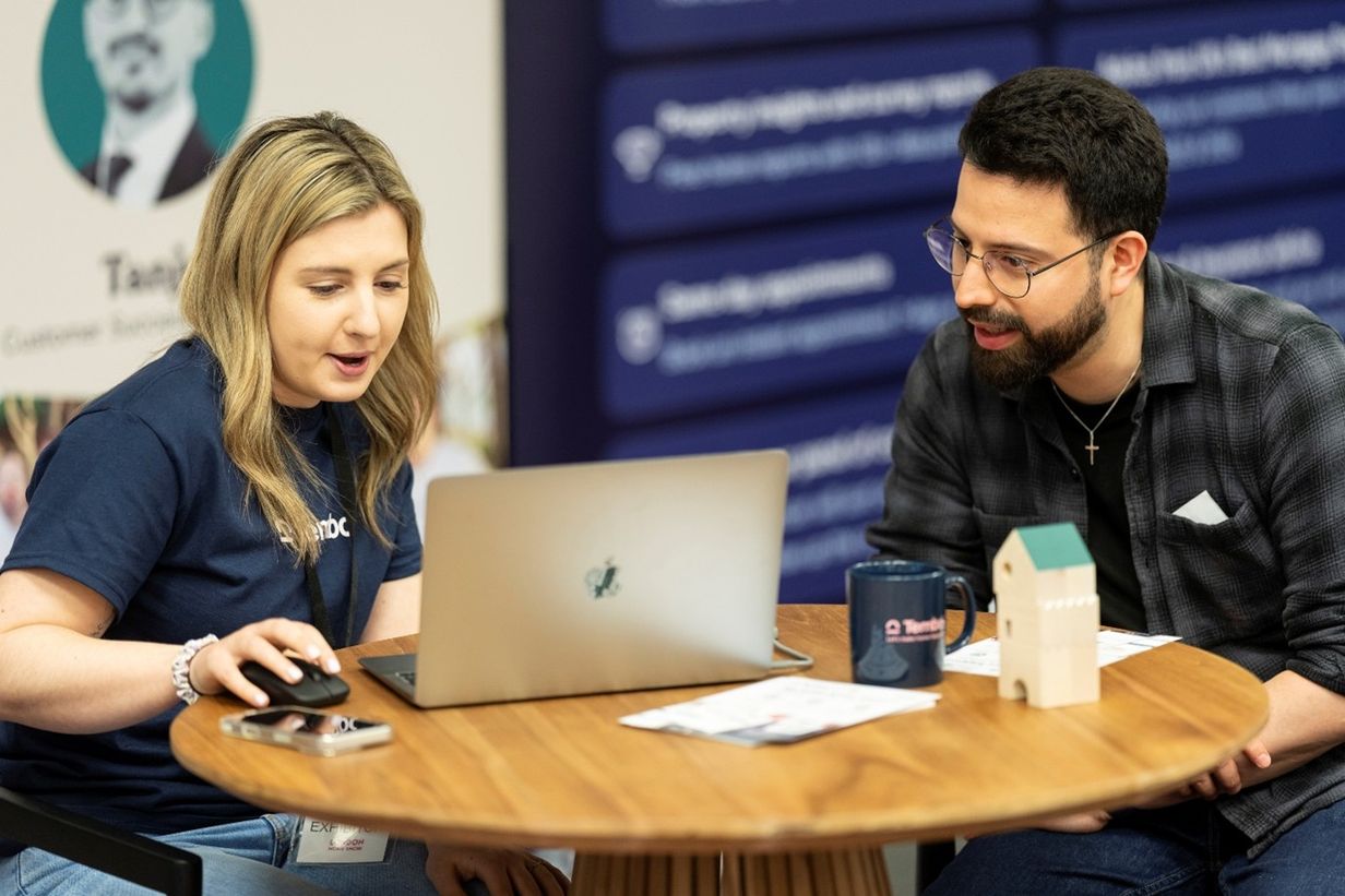 Attendee receiving property advice at the London Home Show 2025.