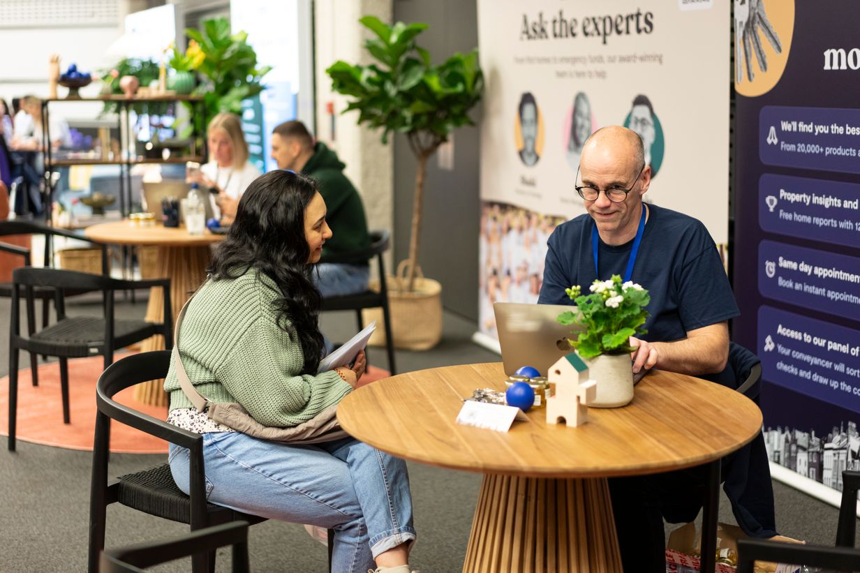 London Home Show attendee getting free financial advice.