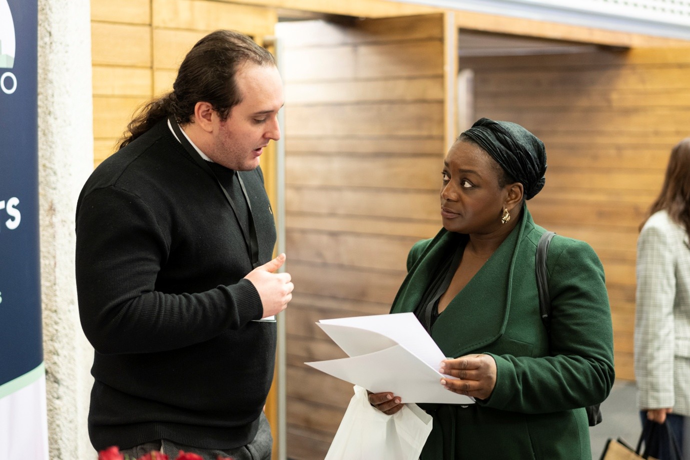 Share to Buy Live event attendee getting advice from housing expert.